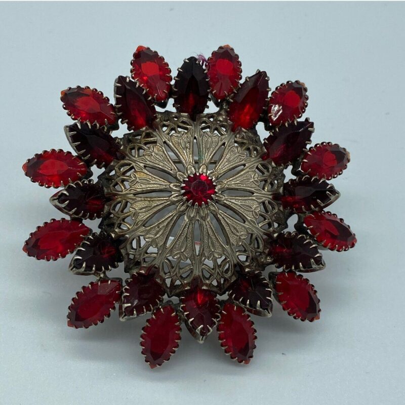 large red rhinestone brooch