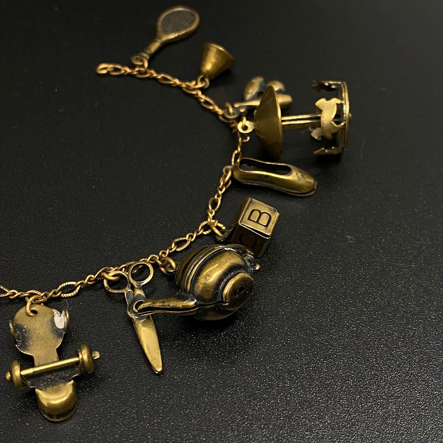 Vintage 1940s Brass Charm Bracelet with some Mechanical Charms