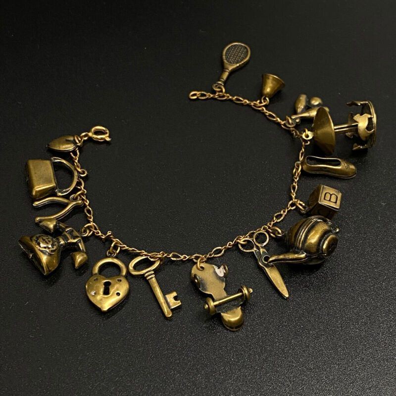 Vintage 1940s Brass Charm Bracelet with some Mechanical Charms