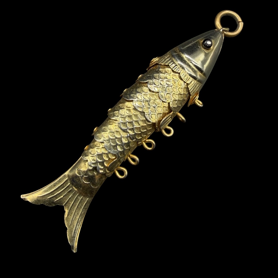 Vintage articulated fish pendant.