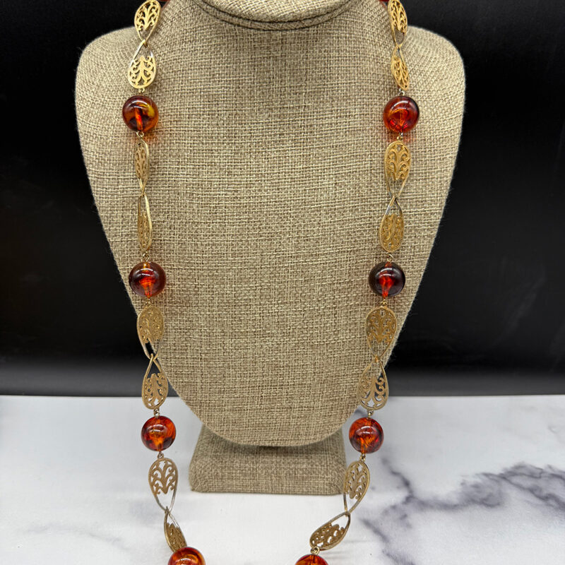 Amber-colored Lucite station necklace.
