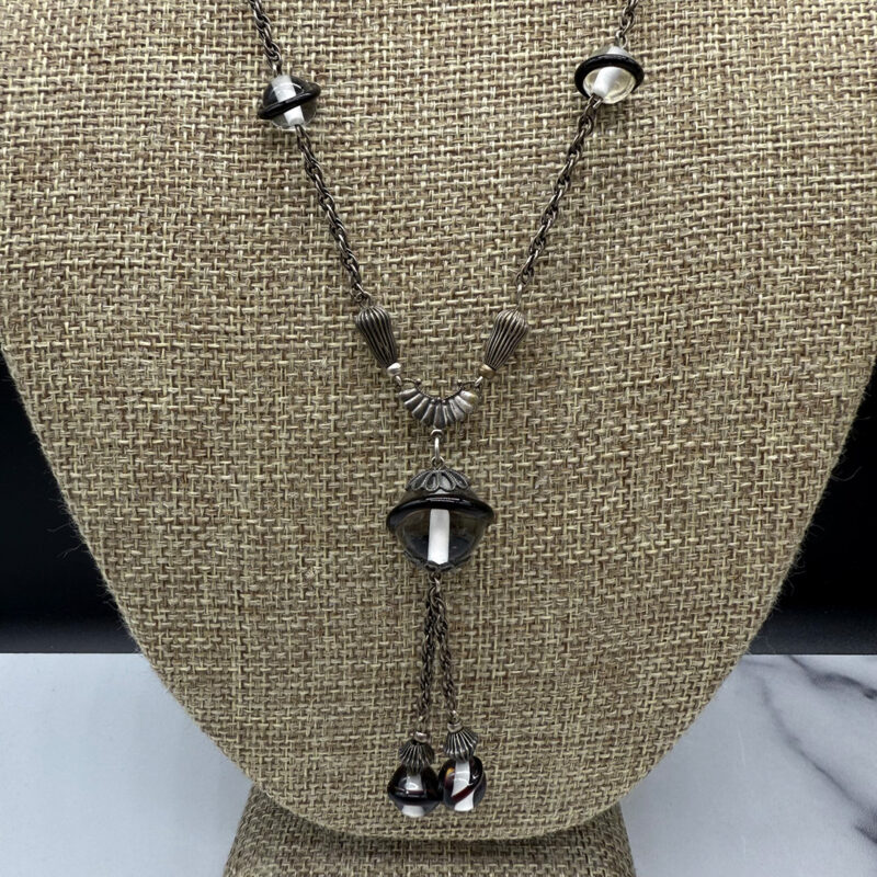 1930s Deco-style sautoir necklace up close.