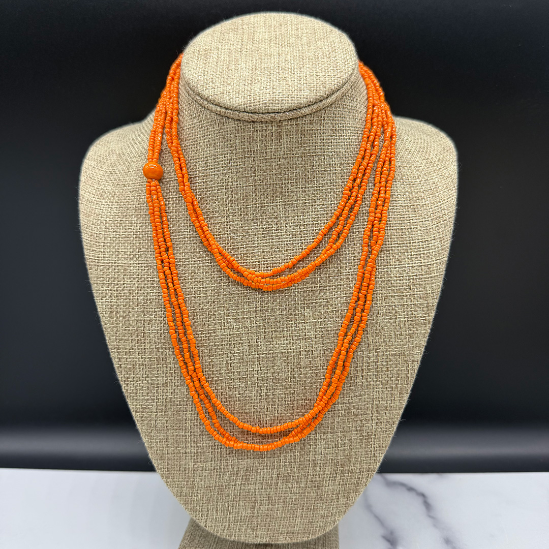 Vintage coral-color seed bead necklace.