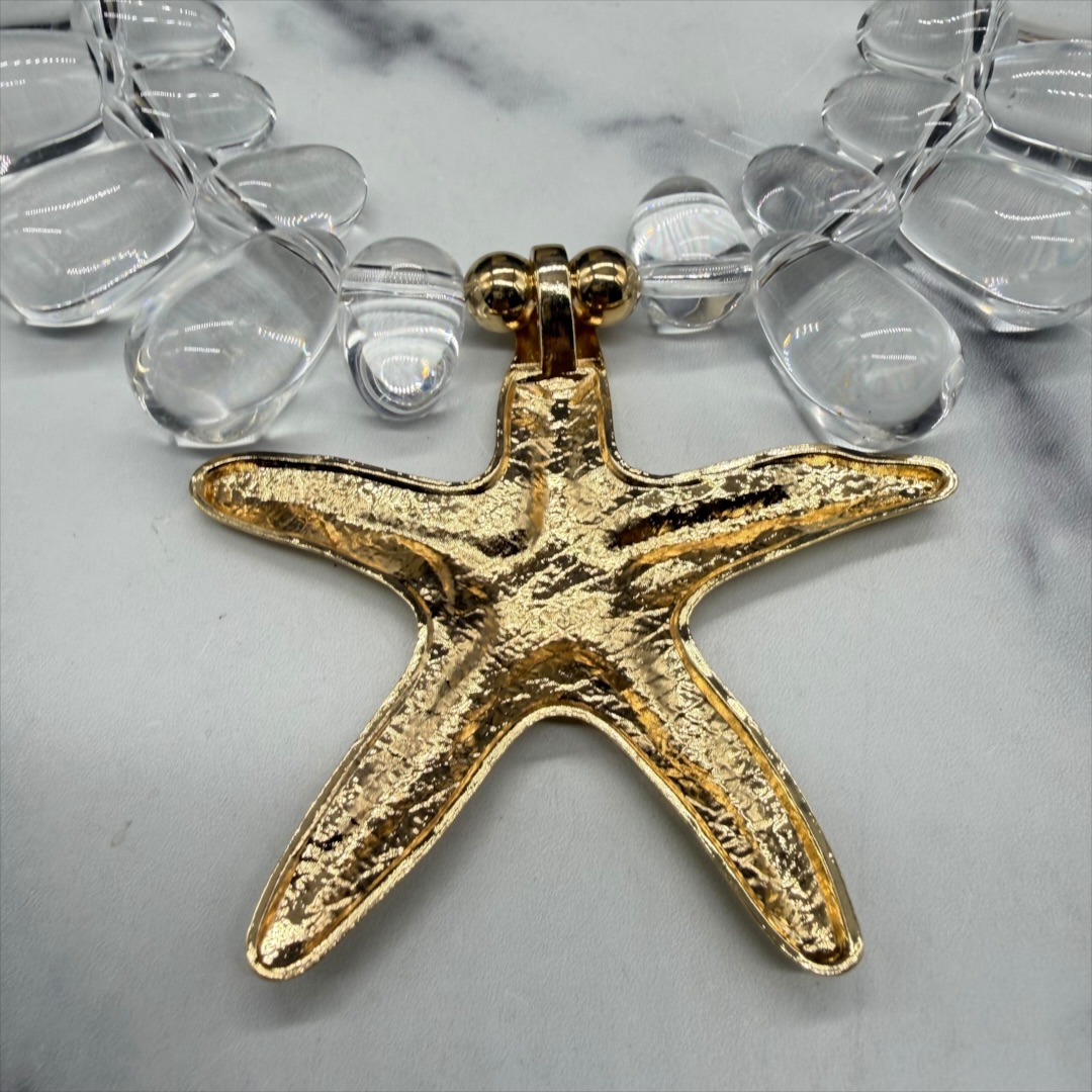 Modern acrylic starfish collar necklace up close back.