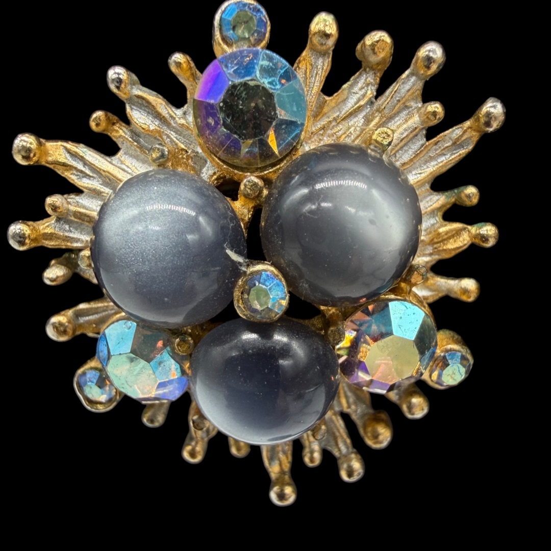 Vintage sculptural earrings up close.